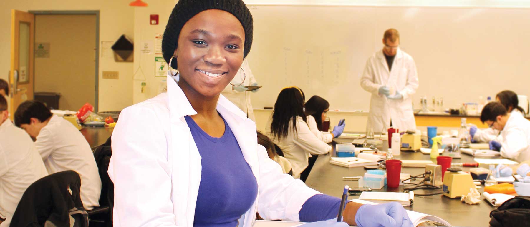 a v.c.u. student participating in a science lab with other students